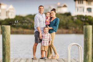 30A family portrait — candid laughing family-of-four dock portrait; photographed by Amanda Eubank Photography along Florida’s Emerald Coast.