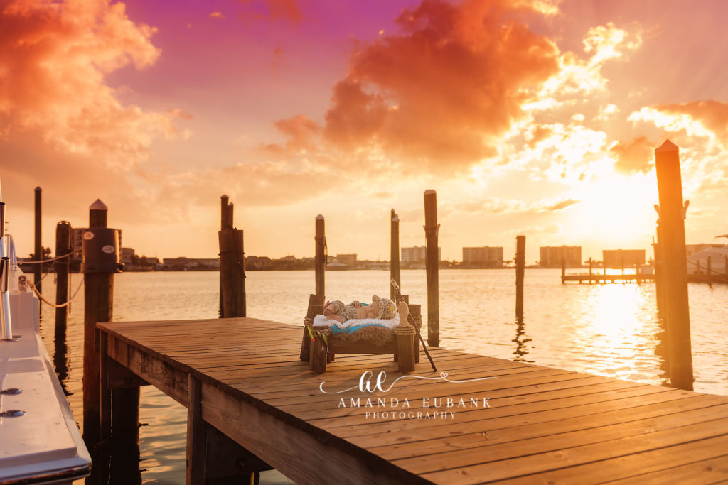 Destin newborn portrait — sleeping newborn-on-the-pallet-bed Destin-Harbor sunset portrait; photographed by Amanda Eubank Photography on the Destin Harbor along Florida’s Emerald Coast.