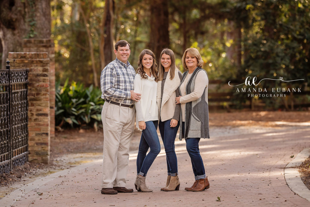 Eden Gardens family portrait — horizontal candid laughing family-of-four portrait; photographed by Amanda Eubank Photography at Eden Gardens State Park along Florida’s Emerald Coast.