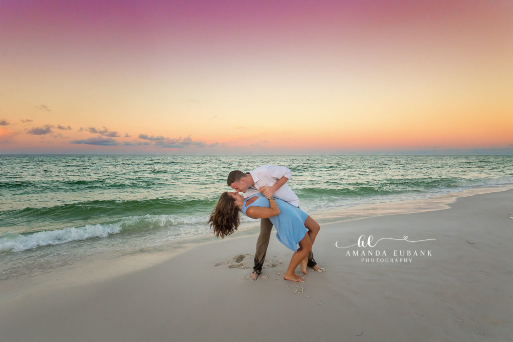 Toes in the tide as Nikki and Kyle share a close embrace during their Destin engagement