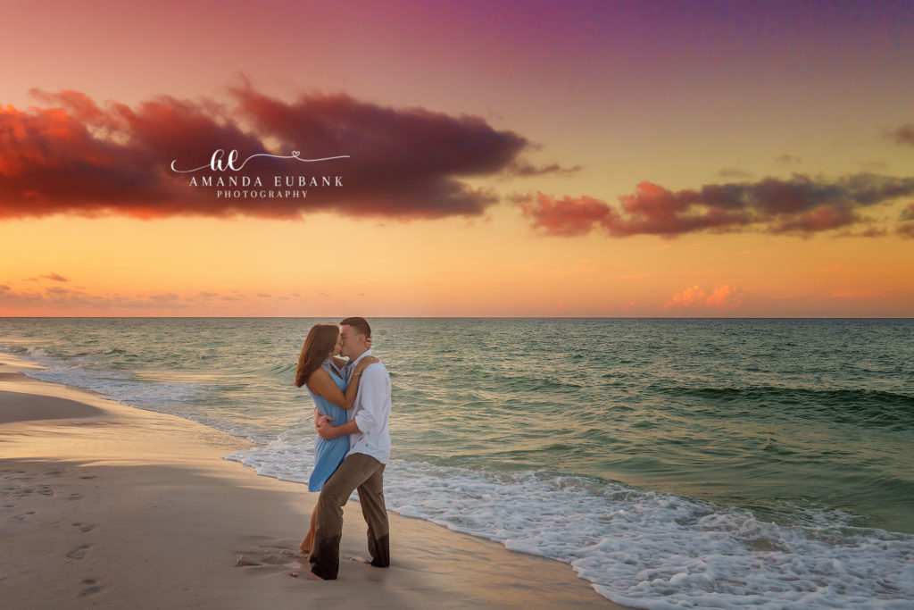 Final sunset embrace of Nikki and Kyle on the white sand beach in Destin