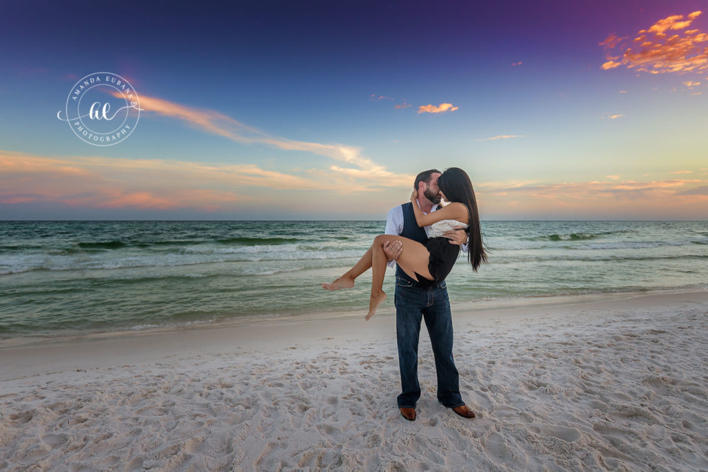 Jessica and Kyle close together along the Destin shoreline during their engagement session on 30A.