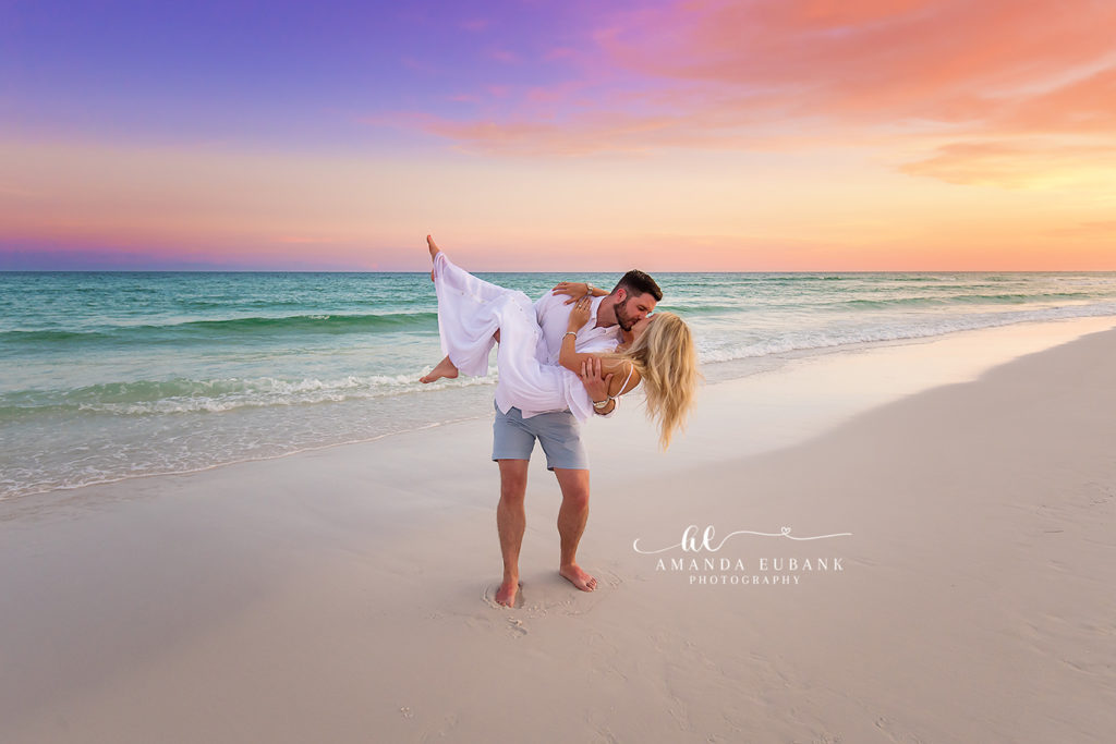 the lavender-and-peach Destin sunset stretching over the Gulf during a sunset shoreline scenic on Destin Beach at sunset, photographed by Amanda Eubank Photography in blue-hour twilight with leading-line composition.