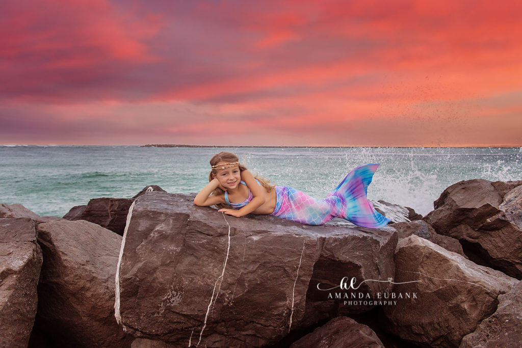 Sweet candid of Isa smiling in her mermaid costume during her birthday session