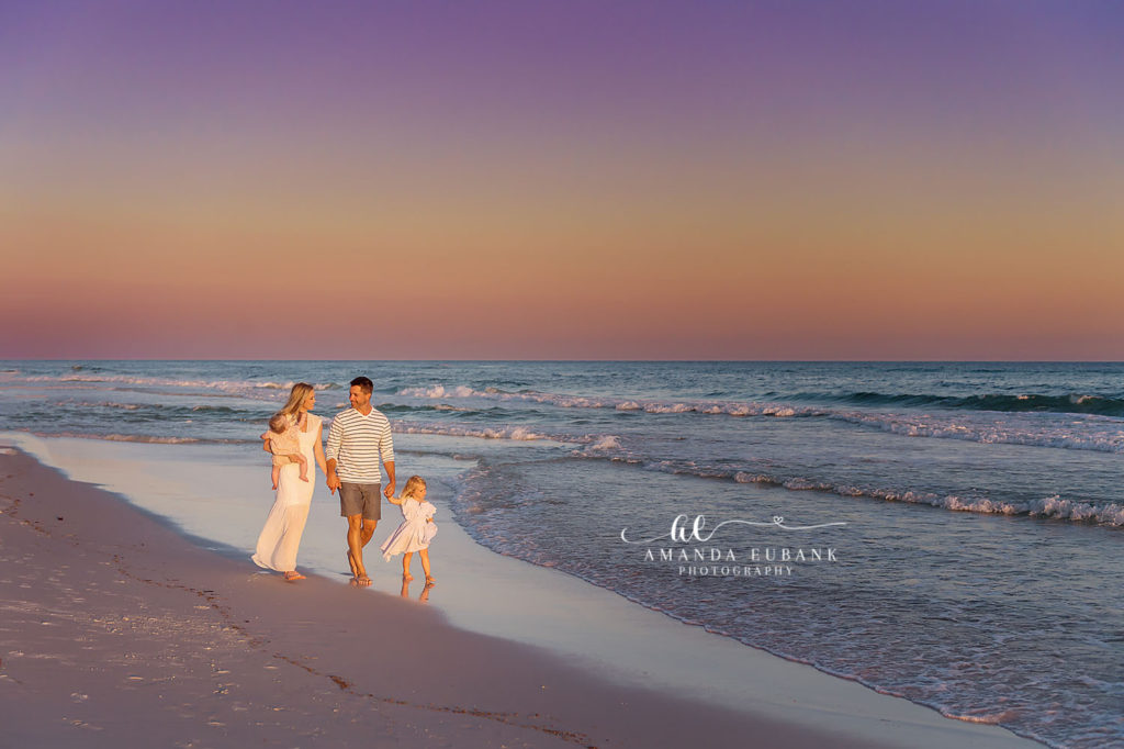 Lalande family hurrying down to the beach to catch the colorful sunset