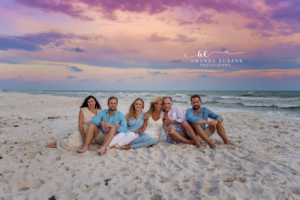 McPherson family looking out at the gulf with gorgeous clearing-storm skies