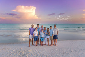 Peaceful Watercolor beach family portrait of the Comptons in coordinated colors