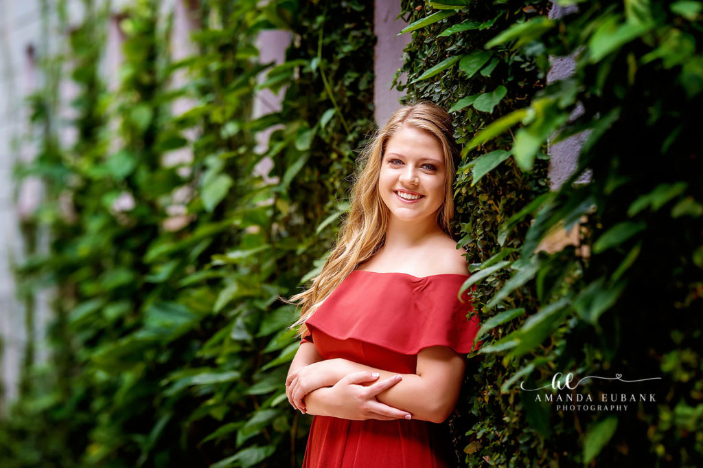 High school senior posing in the lush Watercolor non-beach setting
