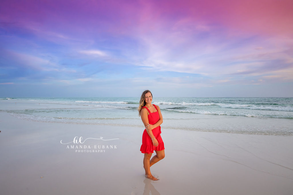 Kerigan's red dress flowing in the gulf breeze along the Rosemary Beach shoreline