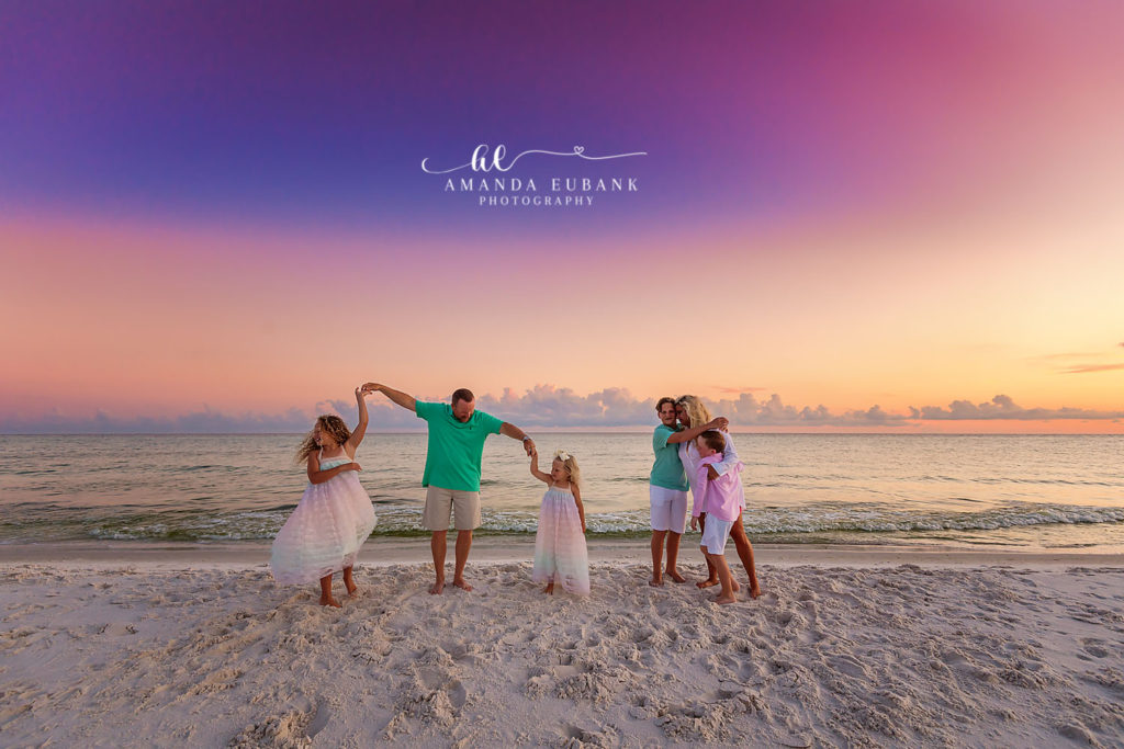 The Cavaness family lined up along Watersound's dune-edge shore at golden hour