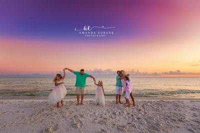 The Cavaness family lined up along Watersound's dune-edge shore at golden hour