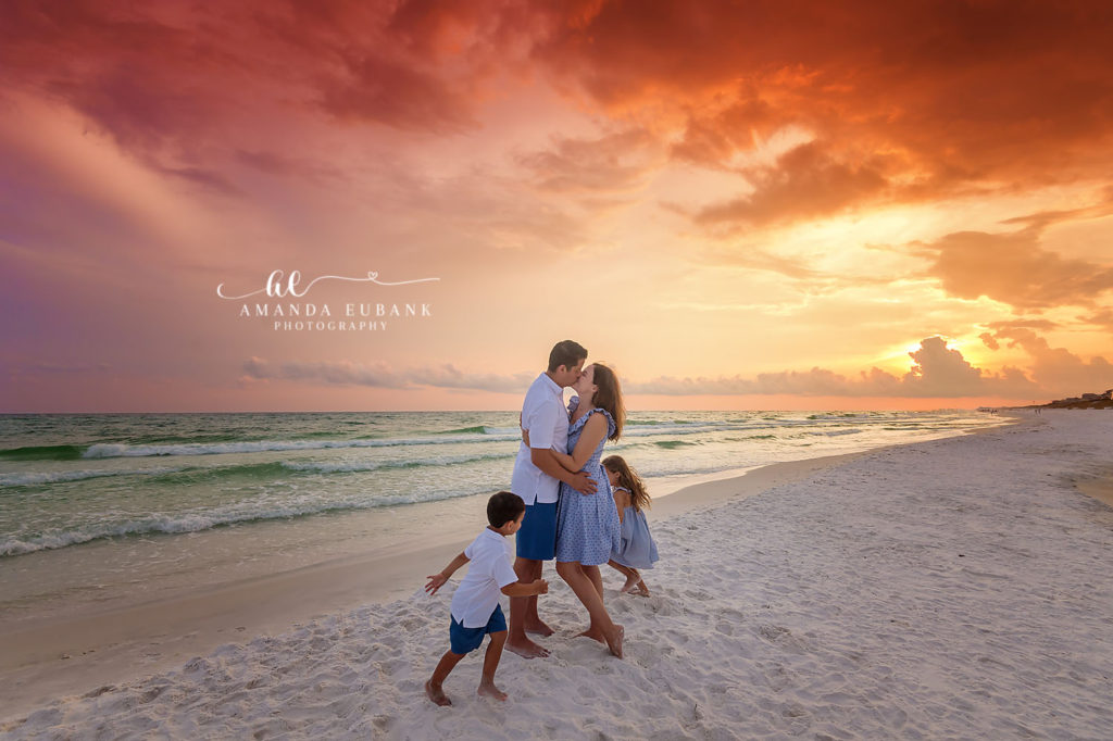 30A beach photographer frames the Lim family beneath an epic post-storm sky