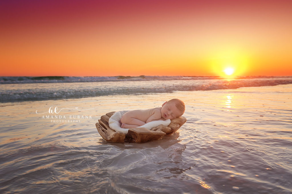 Final sweet portrait of newborn Shep wrapped peacefully during his beach session