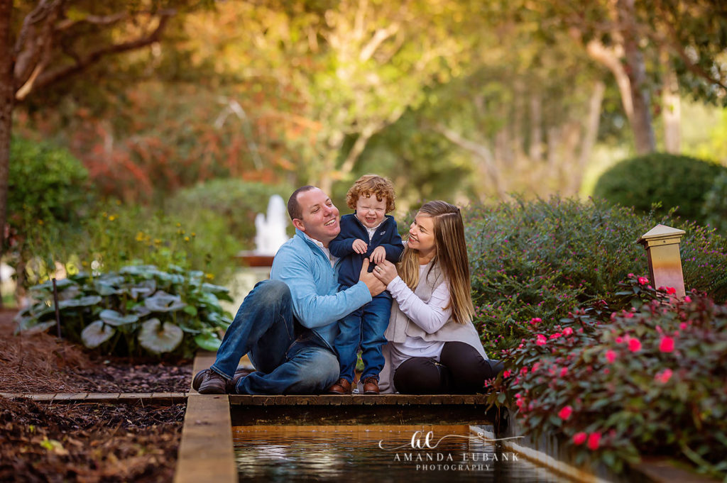 Block siblings hugging close in the manicured Watercolor garden setting