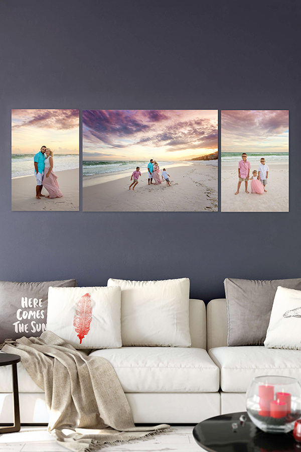 Miramar Beach Family Sunset Triptych Wall Mockup Miramar Beach family sunset portrait triptych wall mockup above a creamy linen sofa with feather and beach themed pillows