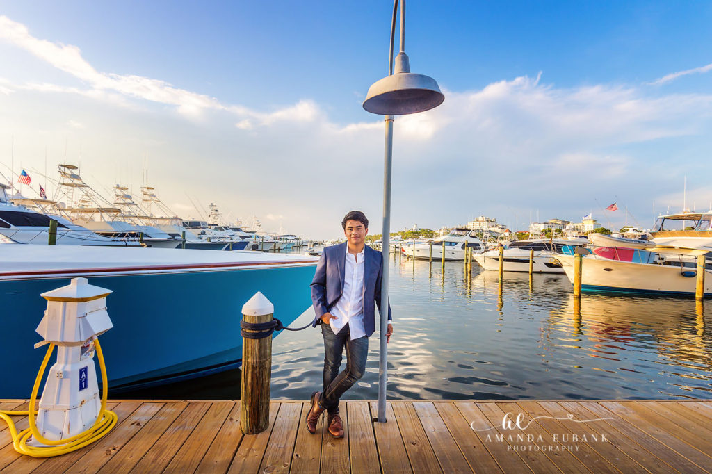 Classic senior backdrop portrait at the Sandestin harbor at last light