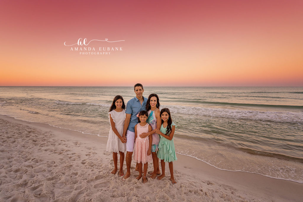 Tender family moment as the Carvajals huddle close in rose-gold dusk light