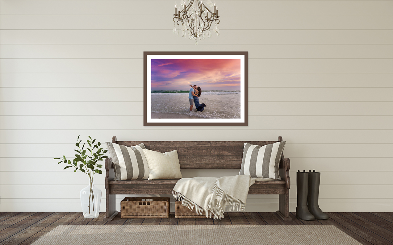 Santa Rosa Beach Photographer — Six-Print Display Mockup Santa Rosa Beach photographer wall art display showing a coastal foyer wall art mockup featuring six framed beach family prints arranged above a rustic bench beneath a chandelier, gentle late-day light, a confident stance, with the horizon stretching wide.