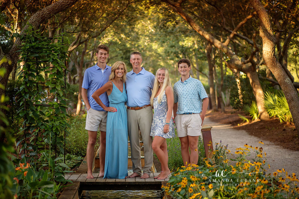 Watercolor family photographer captures the Fox family along the reflecting-pool walkway in the gardens