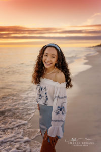 Candid wave-edge laughter during the Atkinson family Rosemary Beach session.