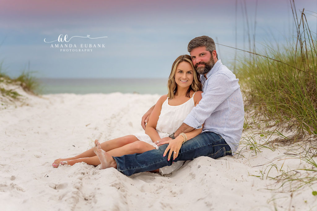 Kimberly & Daniel's anniversary portrait on Rosemary Beach — joyful smiles and pastel Gulf sunset.