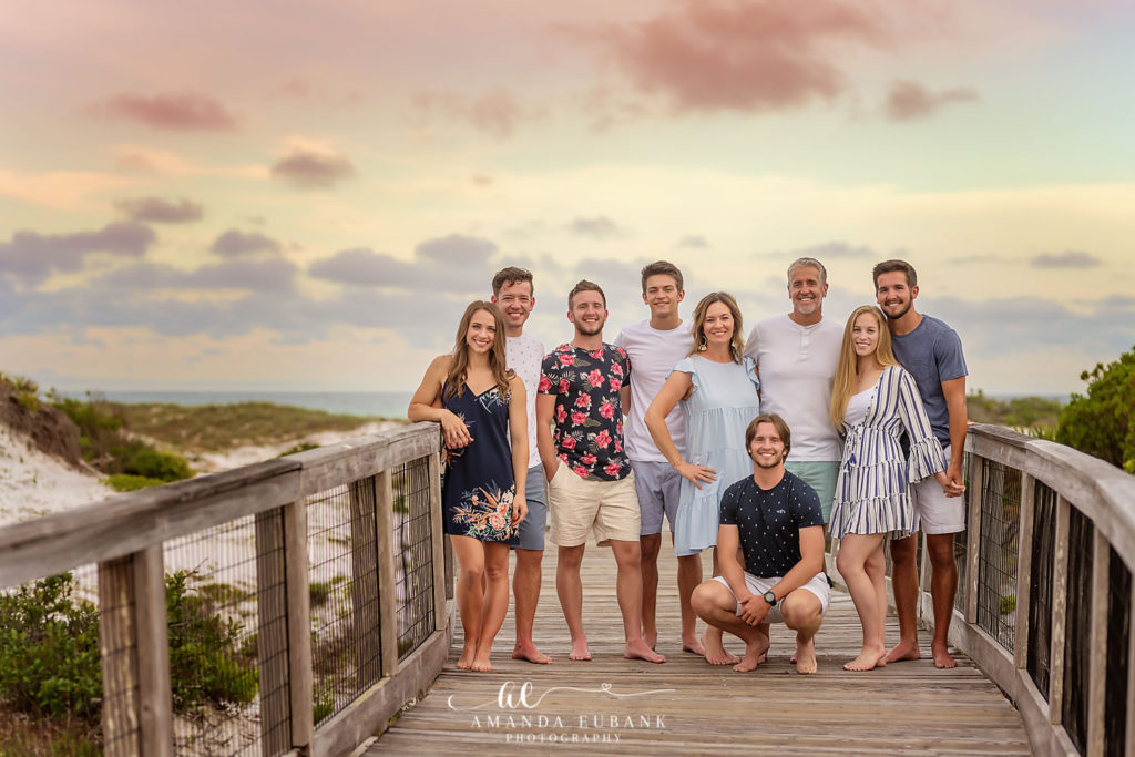 M family beach portrait at sunset on Watersound Beach in coastal casual outfits.