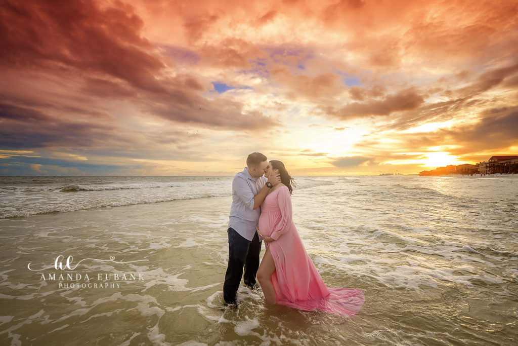 Side profile of the expecting mom at sunset during her Dune Allen Beach maternity session.