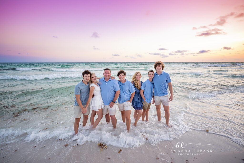A brothers portrait in the surf barefoot in the sand during radiant sunset at Dune Allen Beach, Florida.