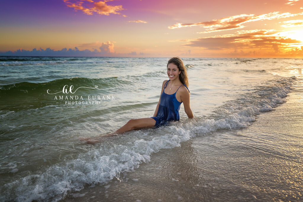 Final sunset surf portrait of Sofia in her deep blue dress at Rosemary Beach