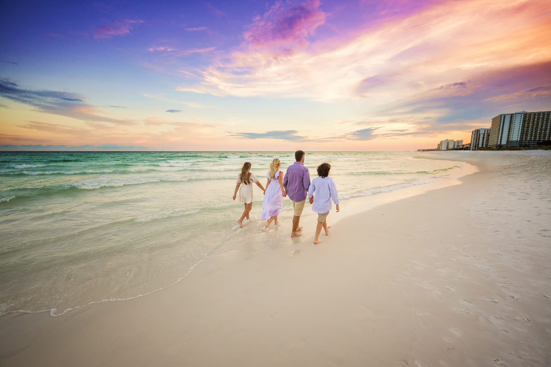 Gonzales Family Destin Beach Sunset Portraits — parents kissing at sunset vol1