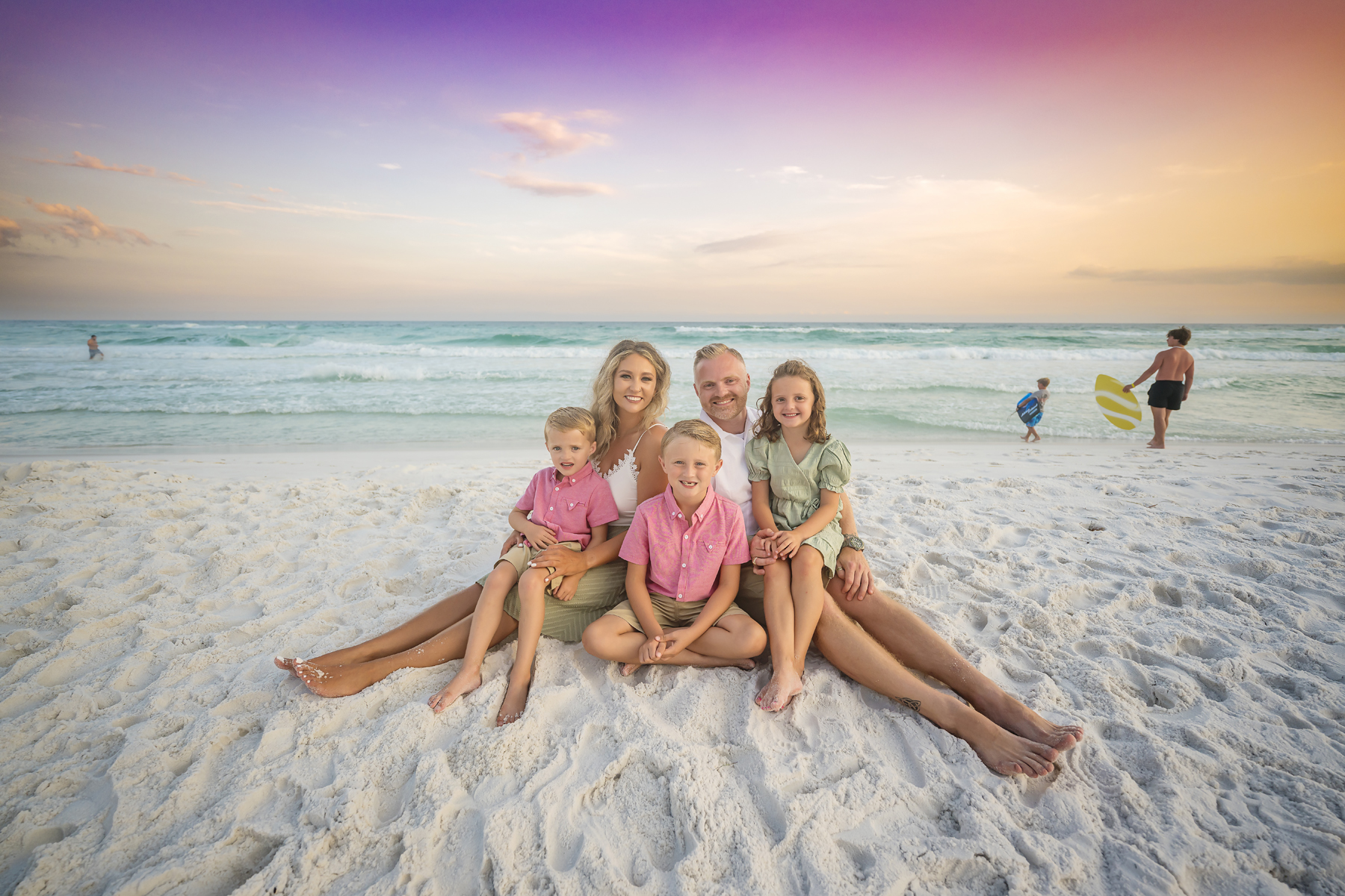 Hendricks Family Destin Sunset Beach Portraits — rainbow sunset behind family at golden hour vol1