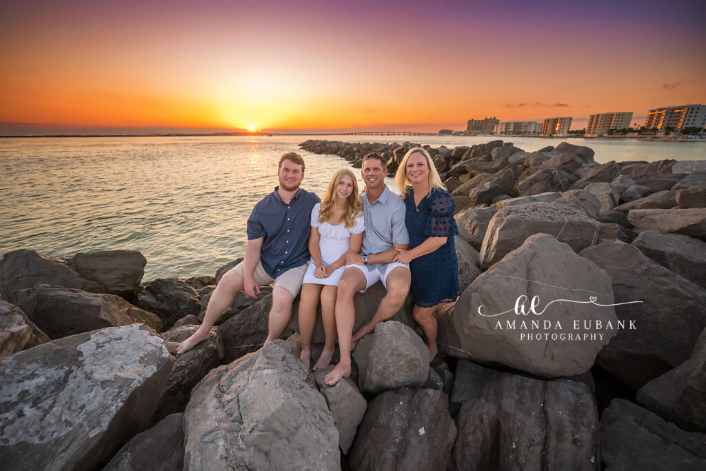 Destin Jetties family photographer — B family glowing in warm sunset light on the dunes