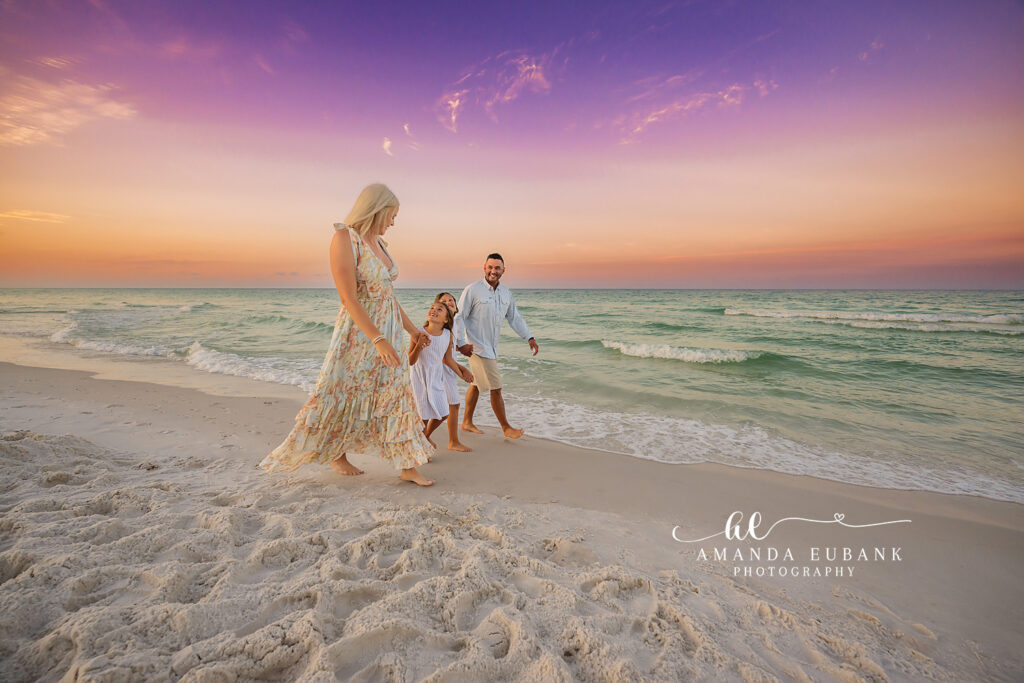 30A sunrise family session — J family standing together on the quiet 30A shoreline at sunrise