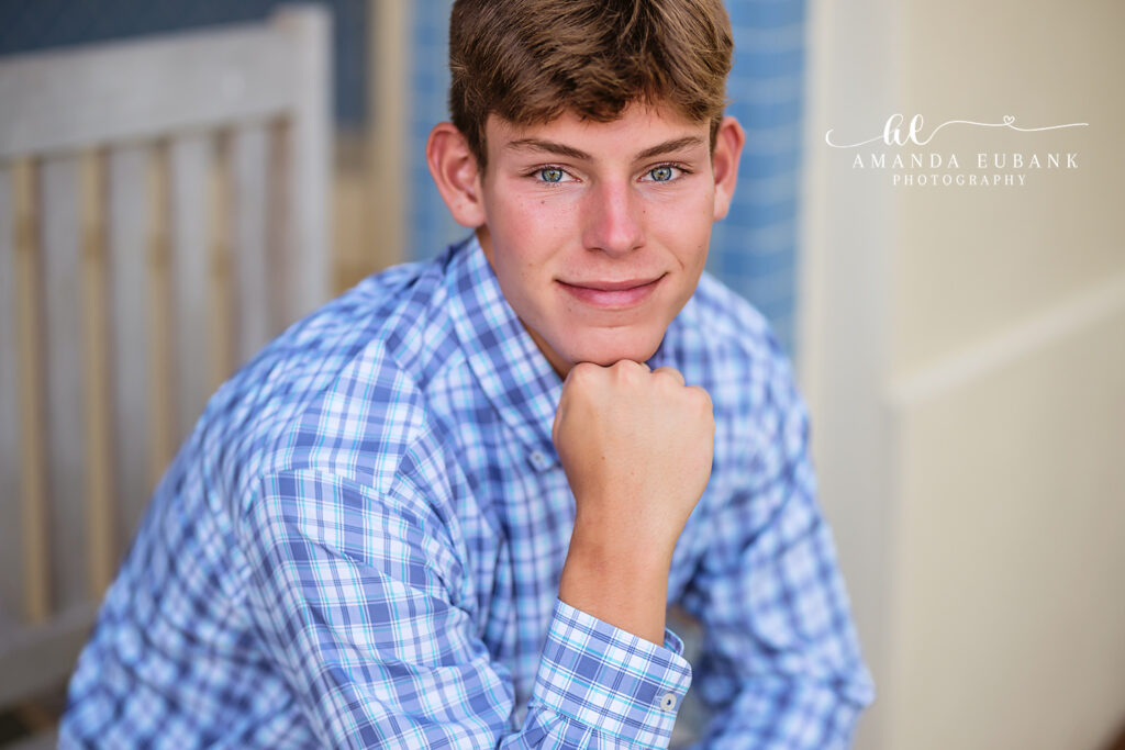 Dillon poses on the Watercolor boardwalk during his 30A senior session.
