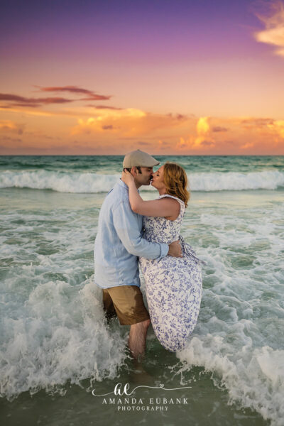 Destin Maternity Sunset Beach Portrait 016 Smith couple laugh together on the Destin sand at sunrise during their maternity session.
