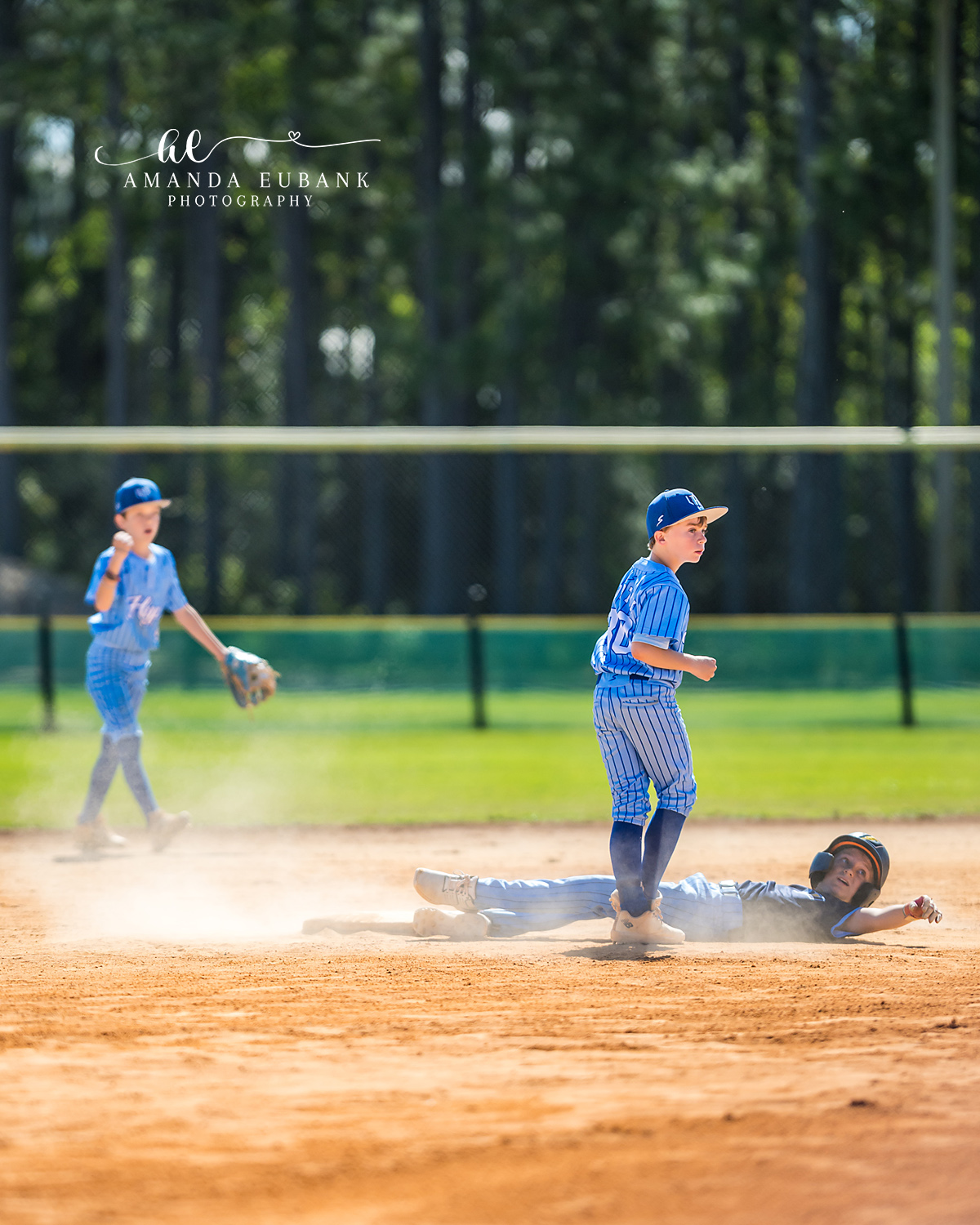Destin Florida Youth Baseball Spring 2026 011 Destin Florida Youth Baseball Spring 2026 — high five at base spring season game vol1