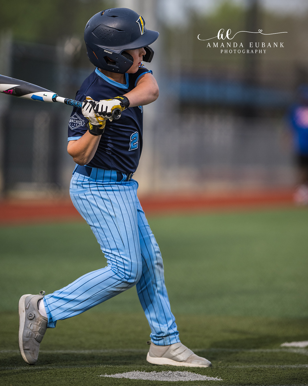 Batter Mid-Swing Stride | Hoover AL Travel Baseball Photographer Power Kilcrease 11U batter strides forward through his swing as the bat extends across his body during a Hoover, Alabama travel baseball tournament game.