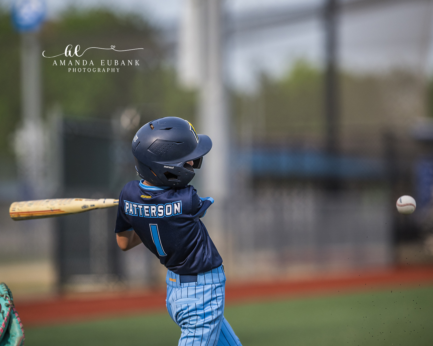 Patterson Number 1 Contact Hit | Hoover AL Travel Baseball Photographer Power Kilcrease 11U batter Patterson number 1, viewed from behind, drives a ball into the outfield with the baseball visible flying away from the bat during a Hoover, Alabama tournament game.