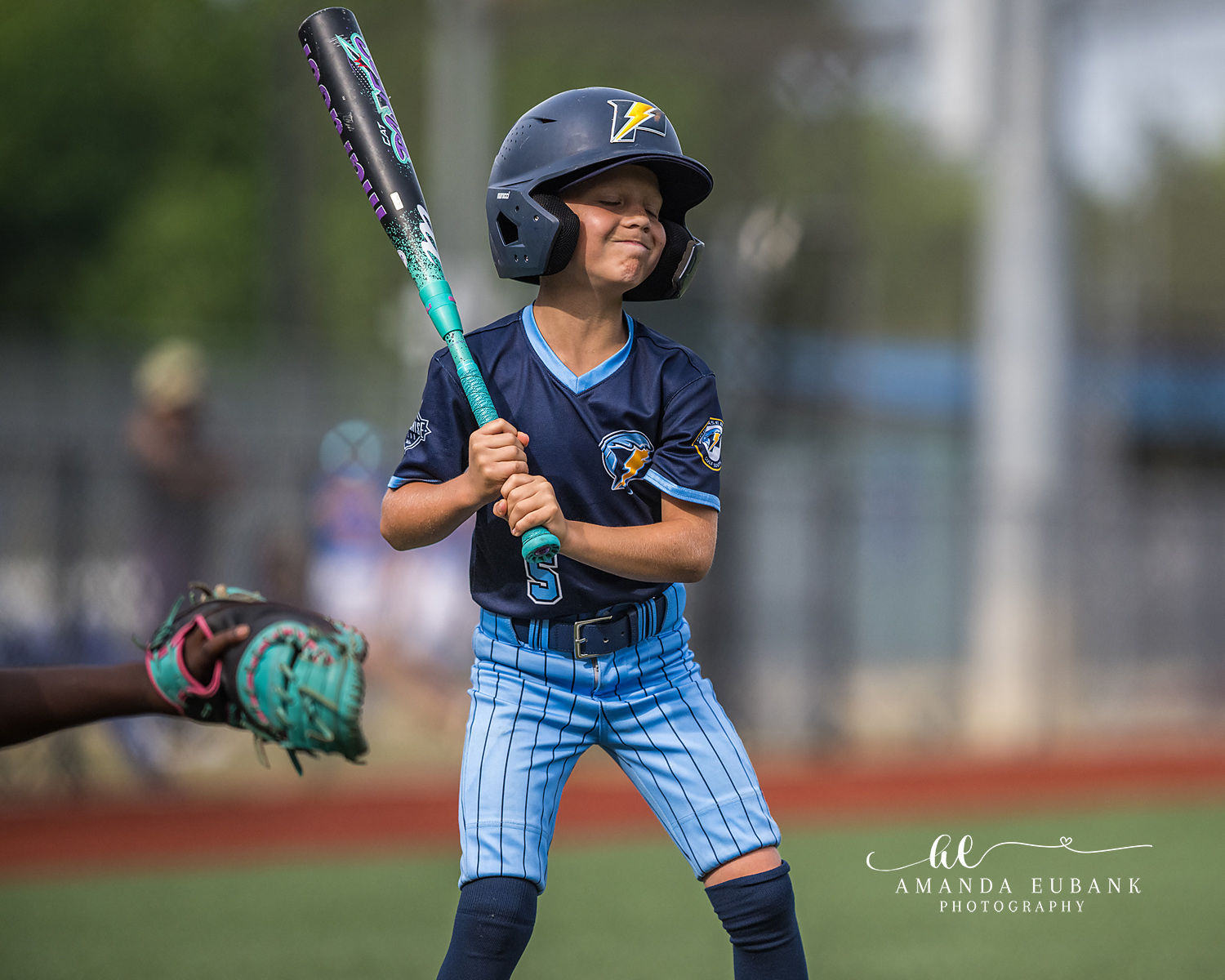 Batter Bracing for Pitch | Hoover AL Travel Baseball Photographer Power Kilcrease 11U batter scrunches his eyes shut in anticipation as the pitch approaches and the catcher's mitt waits at the edge of the frame during a Hoover, Alabama tournament game.