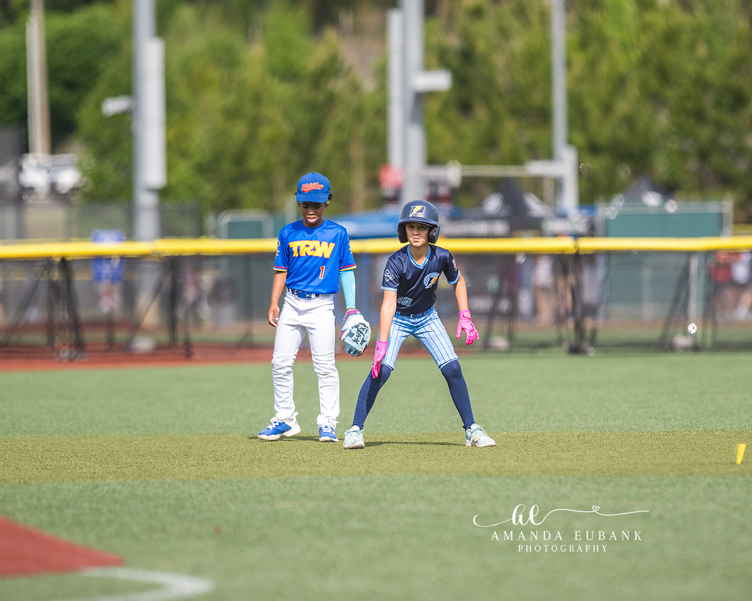 Baserunner Leading Off Second | Hoover AL Travel Baseball Photographer Power Kilcrease 11U baserunner takes an athletic primary lead off second base while a TRW infielder stands behind the bag during a Hoover, Alabama travel baseball tournament game.