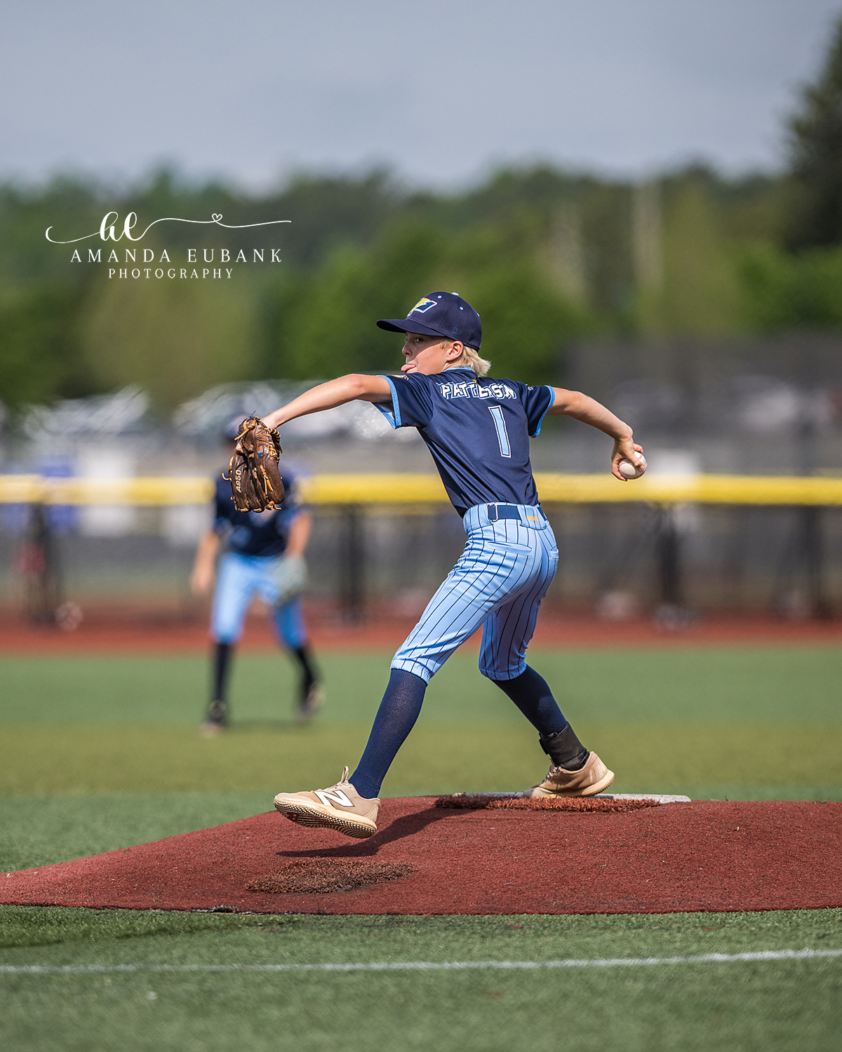 Patterson Number 1 Peak Load From Behind | Hoover AL Travel Baseball Photographer Power Kilcrease 11U pitcher Patterson number 1 reaches peak loaded position from behind on the red dirt mound during a Hoover, Alabama travel baseball tournament game.