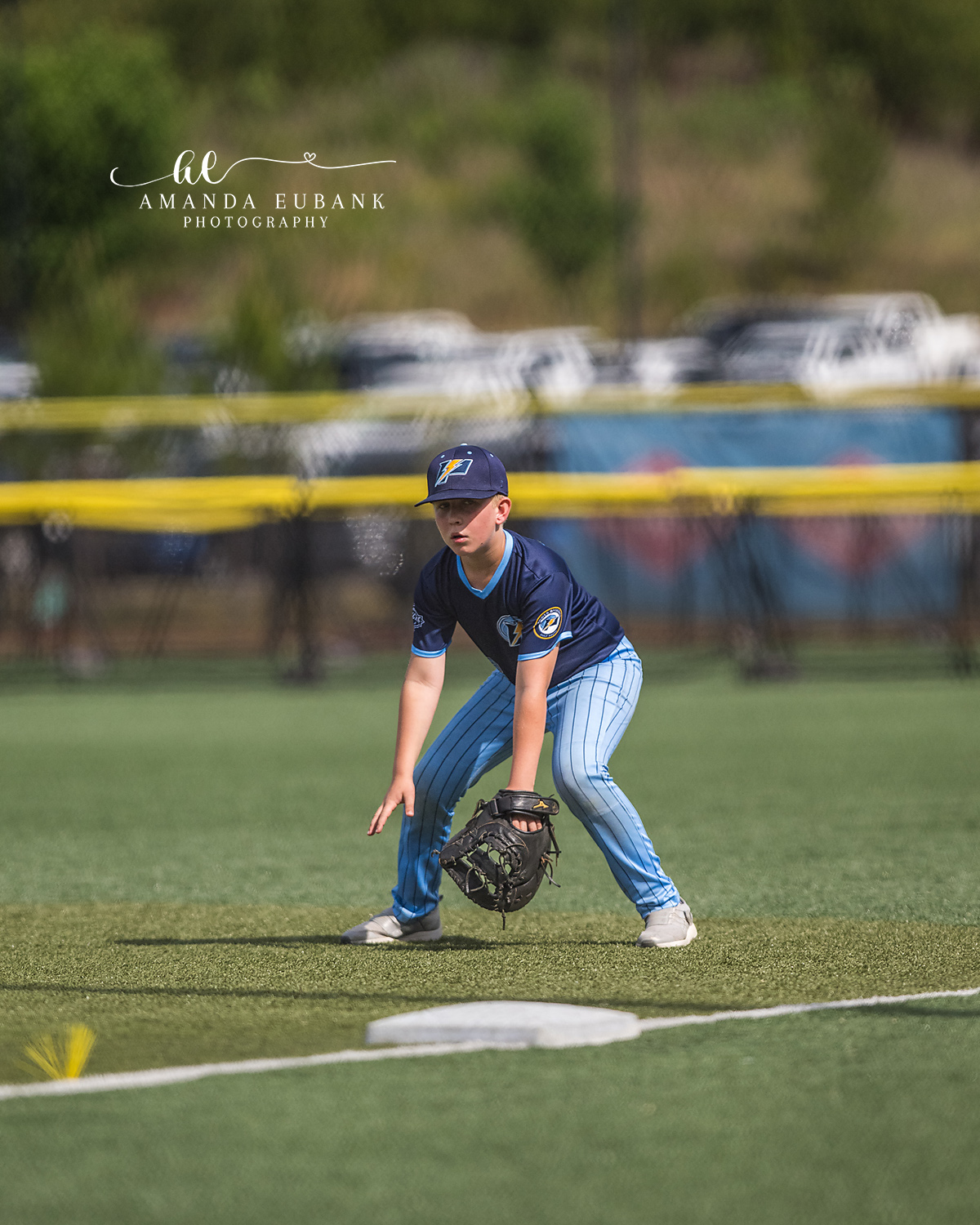 First Baseman Ready Stance | Hoover AL Travel Baseball Photographer Power Kilcrease 11U first baseman drops into a low athletic ready stance with glove near the bag during a Hoover, Alabama travel baseball tournament game.