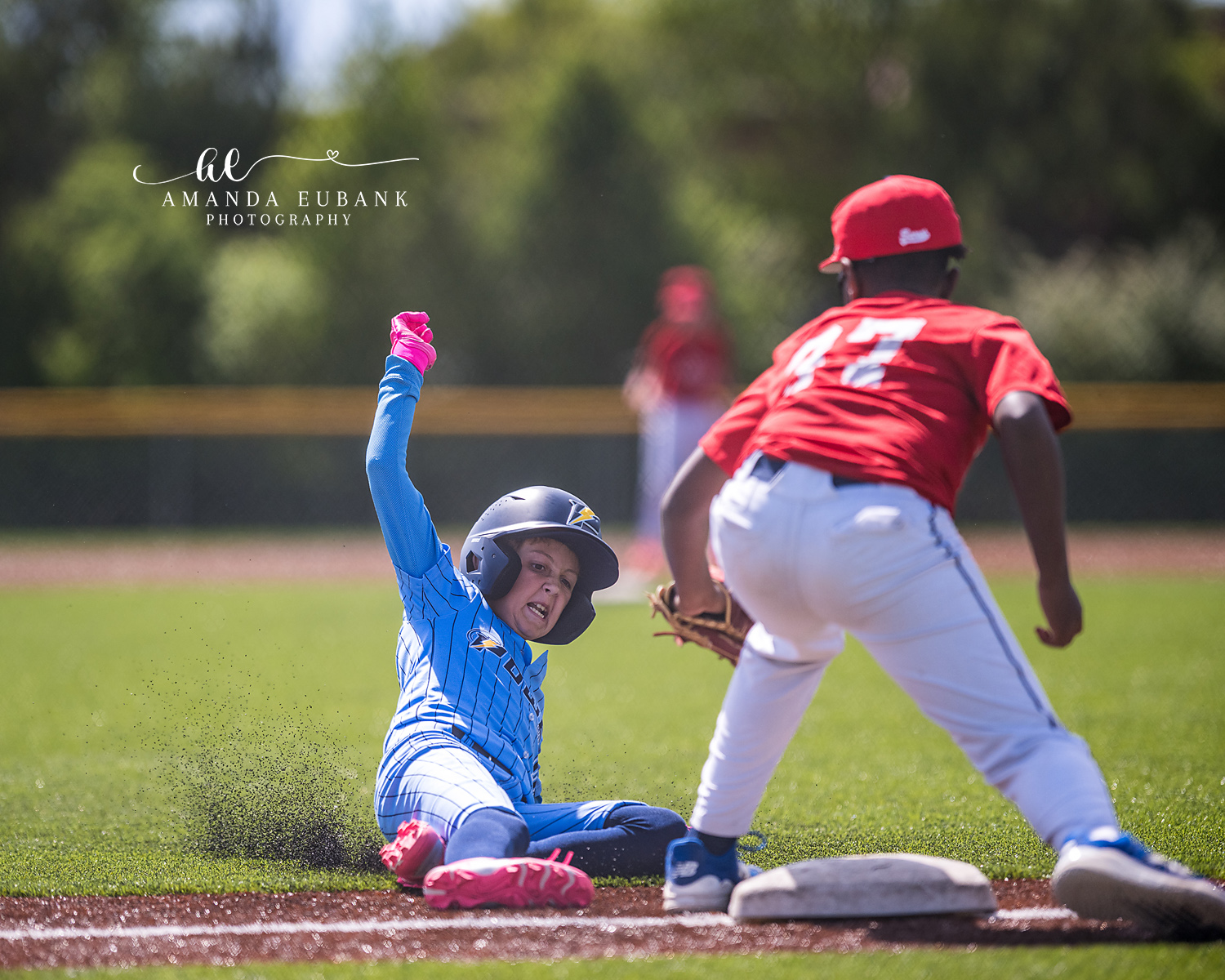 Kilcrease 11U Slide Play at the Bag | Power Baseball Gulf South Hoover AL Kilcrease 11U player sliding into base kicking up dirt as opposing fielder receives the throw during a Power Baseball Gulf South tournament in Hoover AL
