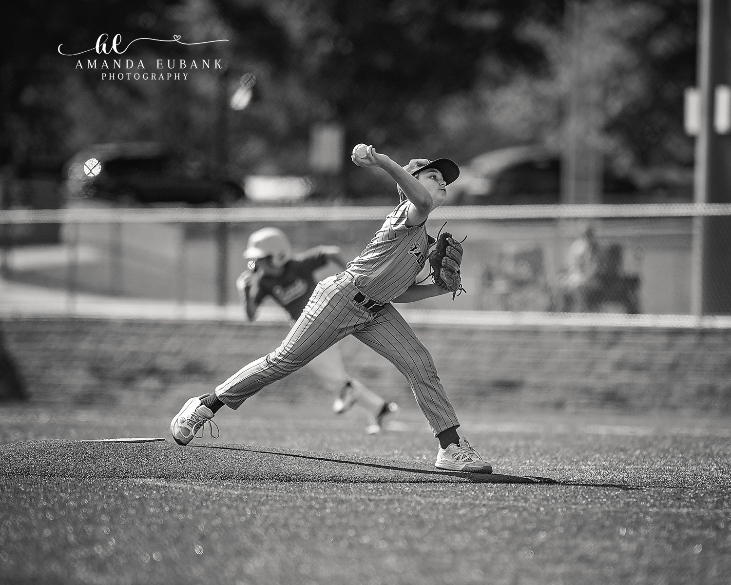 Kilcrease 11U Pitcher Mid-Release Black and White | Power Baseball Gulf South Hoover AL Black and white image of Kilcrease 11U Power Baseball pitcher releasing the ball mid-delivery on the mound at a Hoover AL tournament