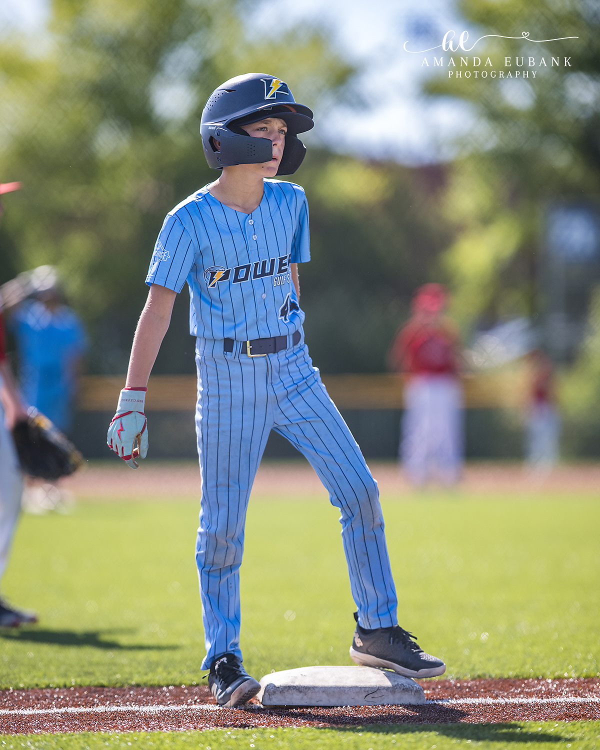Kilcrease 11U Base Runner Standing on the Bag | Power Baseball Gulf South Hoover AL Kilcrease 11U Power Baseball player in blue pinstripe uniform standing on base in batting helmet during a Hoover AL tournament