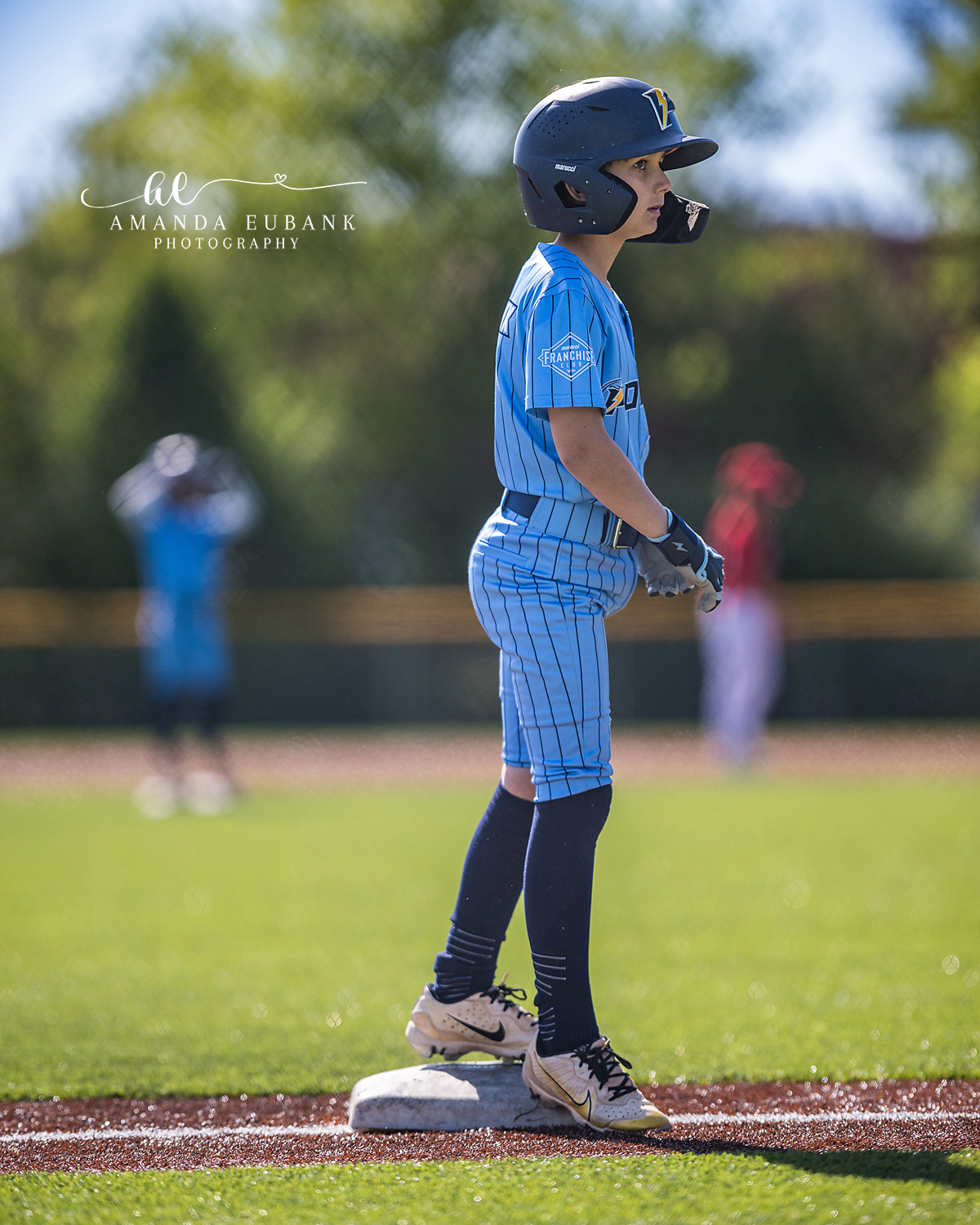 Kilcrease 11U Runner Side Profile on Base | Power Baseball Gulf South Hoover AL Kilcrease 11U Power Baseball runner in light blue pinstripe jersey and navy helmet on base during a Hoover AL tournament