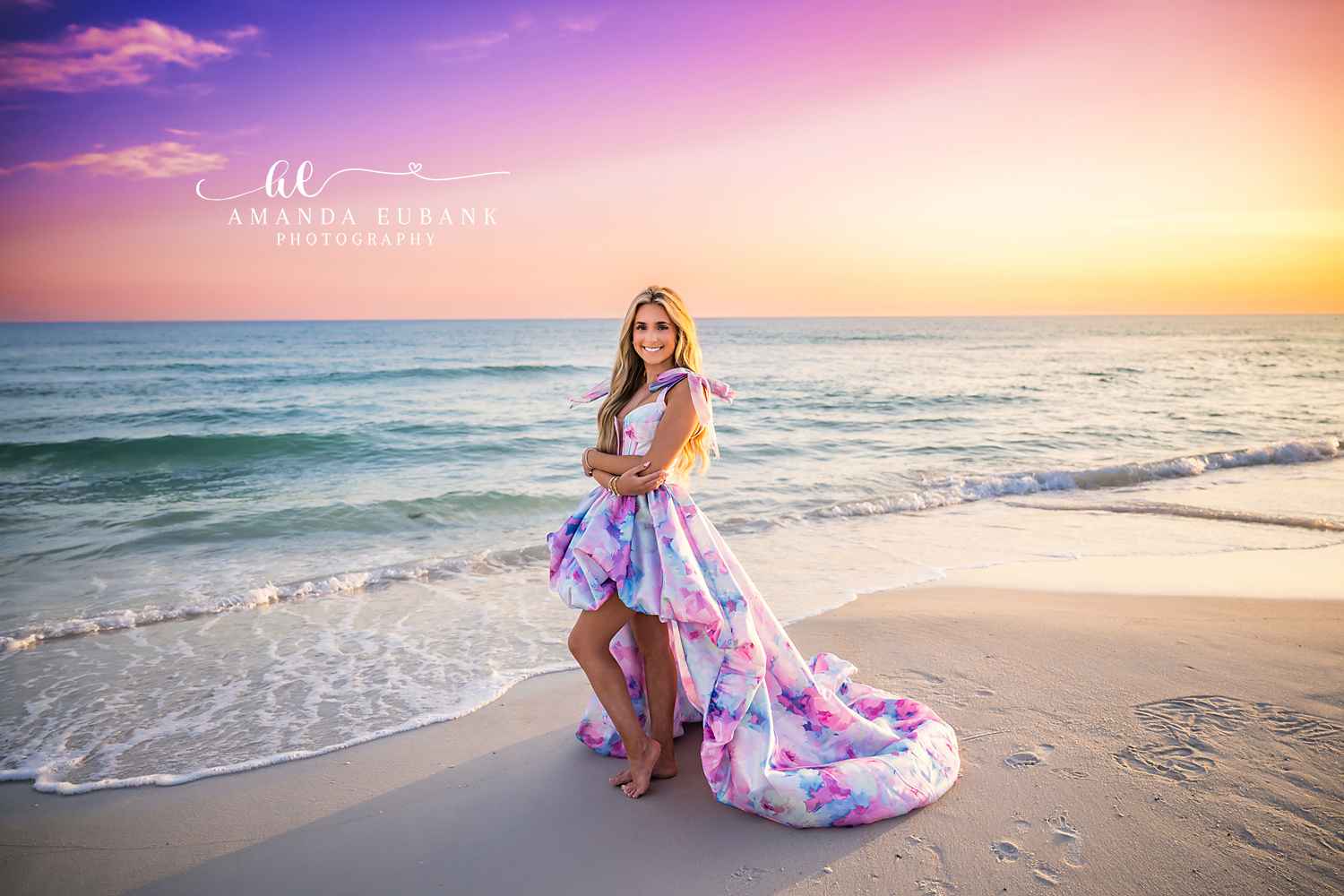 Shoreline Senior Portrait in Watercolor Train Gown | Alys Beach Senior Photographer Senior walking the wet sand in a pastel watercolor high-low gown with flowing train at sunset, by Alys Beach Senior Photographer Amanda Eubank.