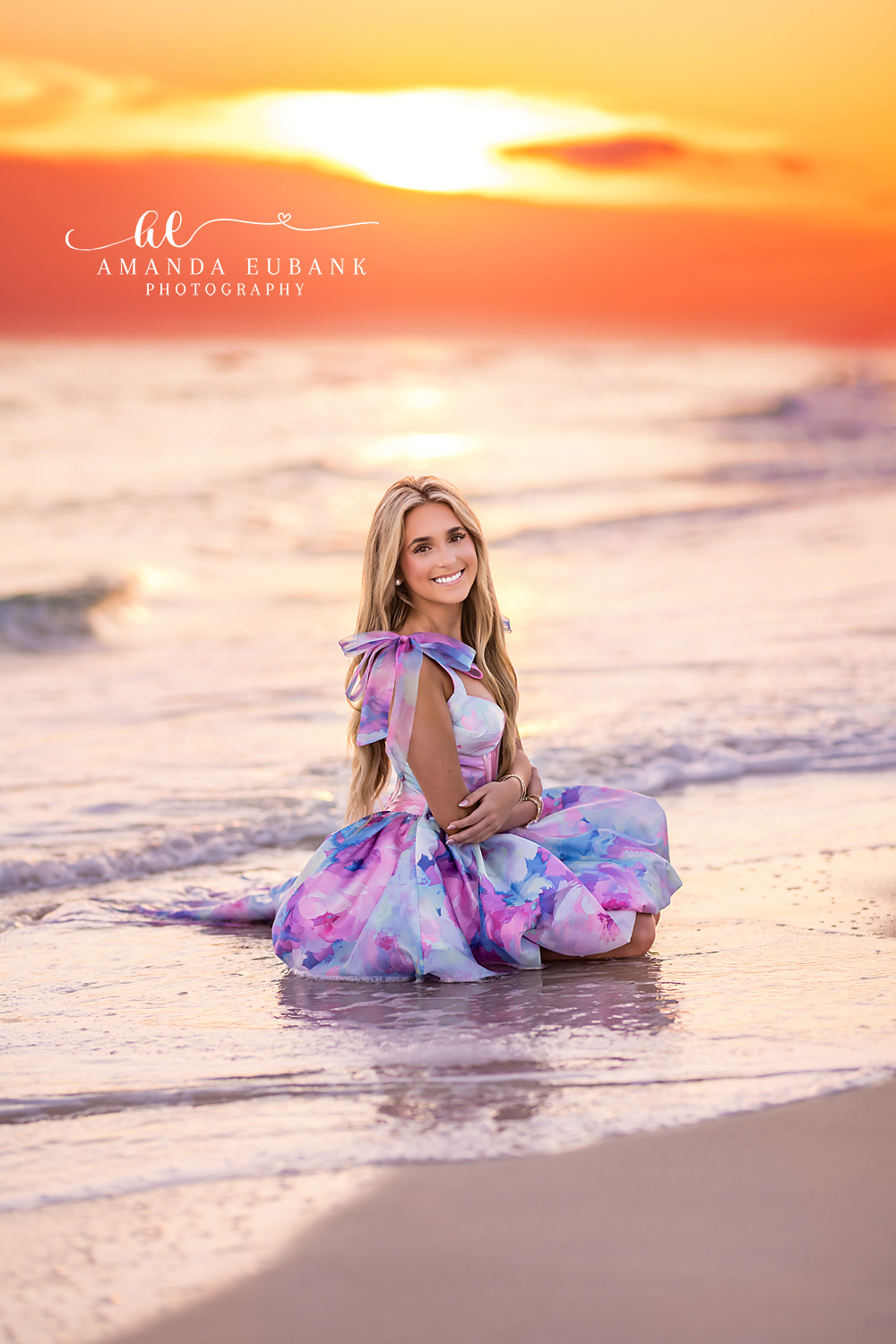 Sunset Senior Portrait on the Beach | Alys Beach Senior Photographer High school senior smiling in a watercolor pastel dress at sunset, photographed by Alys Beach Senior Photographer Amanda Eubank.