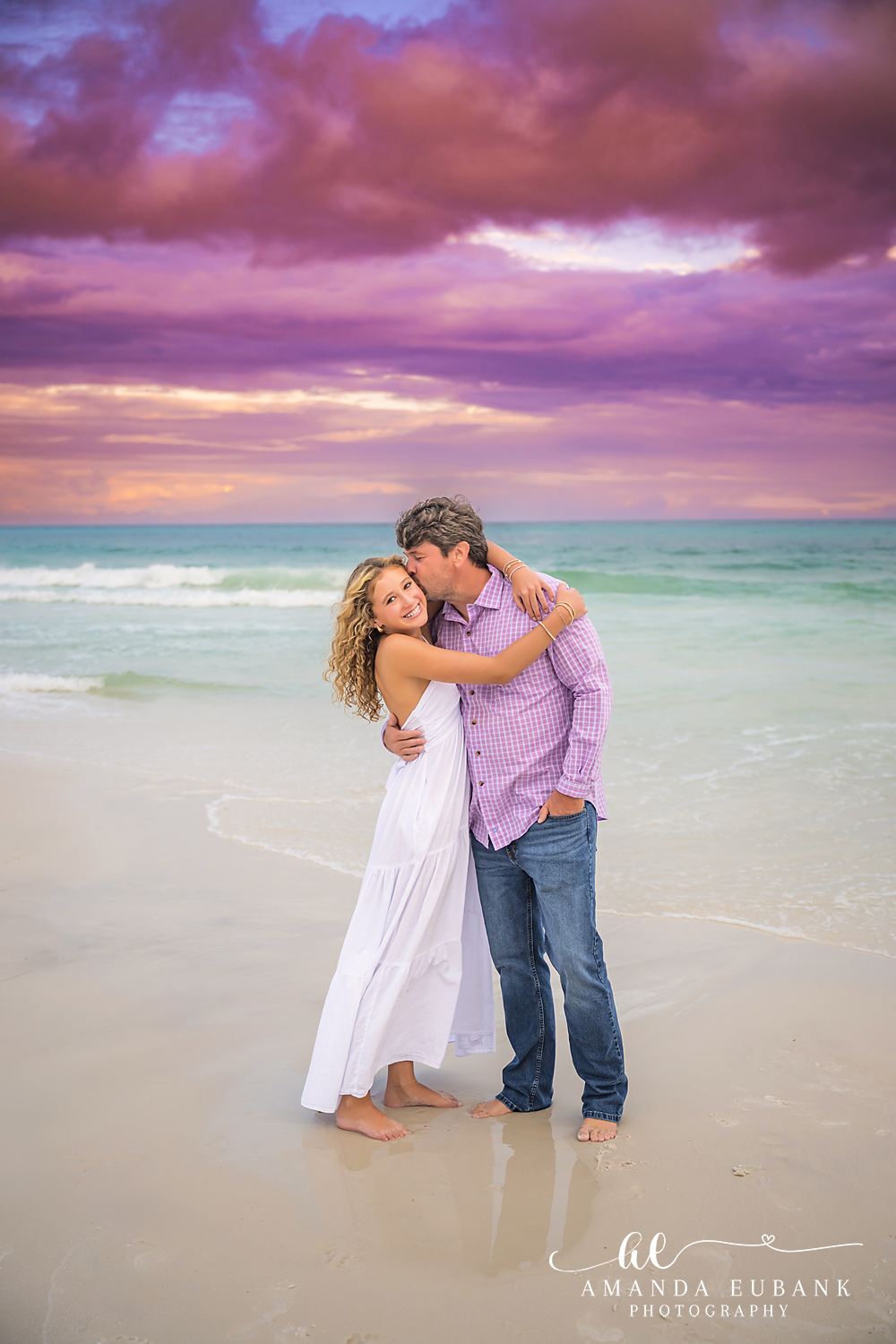 30A Beach Photographer – Candid Kiss at Sunset Quiet moment at the waterline during a Seagrove Beach sunset family session on 30A