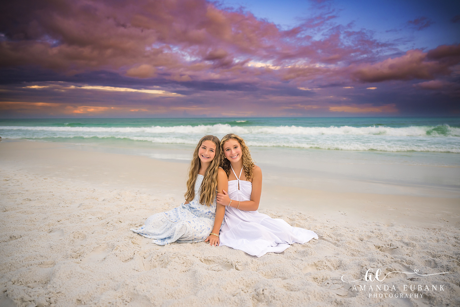 Sisters Beach Portrait on 30A in Santa Rosa Beach, Florida Two girls sitting together on the sand at Seagrove Beach as the 30A sky turns pink